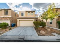 Two-story home boasts a front-facing two-car garage and stone veneer accents at 9019 Winchester Ridge St, Las Vegas, NV 89139