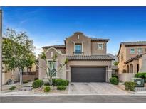Inviting two-story home featuring a well-manicured lawn and a spacious two-car garage at , Las Vegas, NV 89138