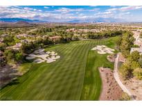 Aerial view of a meticulously manicured golf course with sand traps in a luxury community at 12056 Royal Dolnoch Ct, Las Vegas, NV 89141