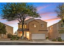 Charming two-story home featuring a well-manicured front yard and attached two-car garage at 1221 Diamond Valley St, Henderson, NV 89052