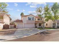 Charming two-story home with a three car garage, tile roof, and desert landscaping at 1287 Dove Tree Ct, Henderson, NV 89014