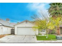 Charming single-story home featuring a two-car garage, well-maintained lawn and mature landscaping at 1574 Teardrop St, Las Vegas, NV 89142