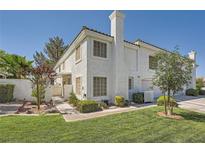 Charming two-story home with a well-manicured lawn and mature landscaping at 2902 Aztec Lily Ln, Henderson, NV 89074