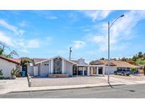 Charming single-story home featuring a low-maintenance gravel yard and covered parking at 4417 Saint Andrews Cir, Las Vegas, NV 89107