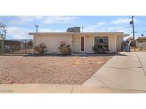 Charming single-story home featuring a low-maintenance gravel yard and a private, fenced front area at 4691 Sun Valley Cir, Las Vegas, NV 89122
