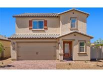 Charming two-story home featuring a brick driveway, neutral colors, and a convenient two-car garage at 6772 Violet Cascade Ave, Las Vegas, NV 89156