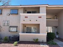 Neutral exterior showcasing a well maintained and landscaped apartment building on a sunny day at 7300 Pirates Cove Rd # 2054, Las Vegas, NV 89145