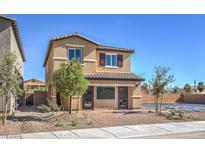 Two-story home featuring a brick-paved driveway and neutral-colored siding and shutters at 794 Calm Crystal Ct # Lot 139, North Las Vegas, NV 89081