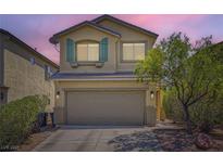 Charming two-story home with a well-manicured yard and a spacious two-car garage at 8469 Cheerful Brook Ave, Las Vegas, NV 89143