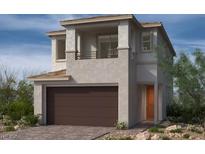 Inviting two-story home featuring a balcony, a neutral color palette, and an attached two-car garage at 143 Silver Run Ln, Las Vegas, NV 89138