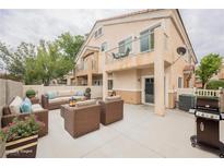 Inviting patio featuring comfortable seating, an outdoor grill, and access to the home's exterior at 1580 Wild Willey Way, Henderson, NV 89002
