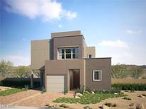Contemporary two-story home featuring a modern design, desert landscaping, and an attached one car garage at 1790 Flycatch St, Las Vegas, NV 89138