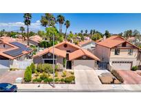 Charming single-Gathering home with a two-car garage, landscaped front yard, and a beautiful terra cotta tile roof at 2704 Miraflores Ave, Las Vegas, NV 89102