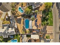 Expansive aerial view of property featuring a pool, solar panels, and lush landscaping at 2885 Horseshoe Dr, Las Vegas, NV 89120