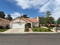 Charming single-story home featuring a well-manicured lawn and a two-car garage, perfect for comfortable living at 9028 Cypress Point Way, Las Vegas, NV 89117