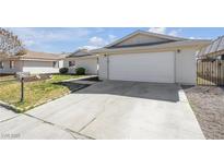 Charming single-story home featuring a two-car garage and manicured front yard at 1616 Yellow Rose St, Las Vegas, NV 89108