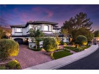Beautiful front exterior with paved driveway and well-maintained landscaping at 2 Yorkridge Ct, Henderson, NV 89052