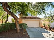 Charming two-story home showcasing a well-manicured lawn and attached two-car garage at 2333 Silver Crew Pass, Henderson, NV 89052