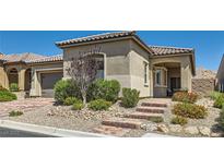 Charming single-story home with landscaped front yard and inviting brick steps to the front door at 3434 Boleo Ct, Las Vegas, NV 89141