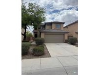 Traditional two-story home with a large driveway and a well-maintained front yard at 3748 Autumn King Ave, Henderson, NV 89052