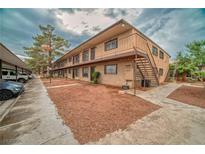 Two-story apartment building featuring exterior stairs and assigned parking at 595 S Royal Crest Cir # 24, Las Vegas, NV 89169