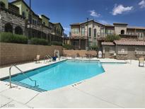 Enjoy this sparkling community pool with convenient lounge seating and a nearby restroom at 6450 Spring Jog St, Las Vegas, NV 89166