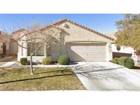Single story home featuring desert landscaping, an attached two car garage, and neutral paint at 7755 Pacific Rim Ct, Las Vegas, NV 89139