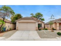 Charming single-story home with a two-car garage and desert landscaping at 7949 Long Beach St, Las Vegas, NV 89139