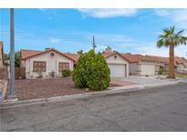 Charming single-story home featuring a well-maintained lawn and a two-car garage at 8024 Hackberry Dr, Las Vegas, NV 89123