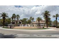 Elegant community entrance with water feature, lush landscaping, and well-maintained grounds, exuding a luxurious atmosphere at 2050 W Warm Springs Rd # 4211, Henderson, NV 89014