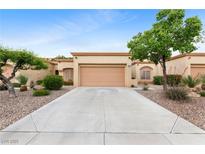 Charming single-story home with a well-maintained front yard and two-car garage at 2231 Hallston St, Las Vegas, NV 89134