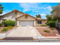 Charming single-story home featuring a well-maintained lawn and a spacious two-car garage at 3594 Wild Cherry Ct, Las Vegas, NV 89121
