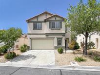 Inviting two-story home features a neutral color scheme and a well-manicured front yard at 4439 Yellow Harbor St, Las Vegas, NV 89129