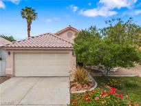 Charming single-story home showcasing a two-car garage, desert landscaping, and a welcoming entrance at 4517 Rodman Dr, Las Vegas, NV 89130