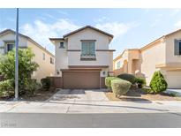 Charming two-story home with a well-maintained front yard and attached two-car garage at 7047 Sombra Way, Las Vegas, NV 89113