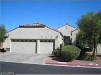 Charming single-story home featuring a two-car garage, desert landscaping, and a neutral color scheme at 8024 Pandur St, Las Vegas, NV 89131