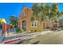 Attractive two-story home featuring an inviting facade and a well-manicured front yard at 8409 Insignia Ave # 102, Las Vegas, NV 89178
