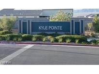 Welcoming entrance sign for the Kyle Pointe community with well-manicured landscaping at 10204 Kern Peak St, Las Vegas, NV 89166