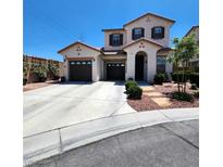 Charming two-story home featuring a spacious driveway, dual garage, and well-maintained landscaping at 11201 Newbury Hills Ave, Las Vegas, NV 89138