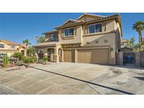 Inviting two-story home with a three-car garage and well-maintained landscaping at 1191 Starstone Ct, Henderson, NV 89014