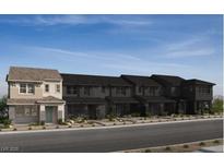 New townhome construction showing multiple units and modern architectural details in a desirable community at 128 Silver Run Ln, Las Vegas, NV 89138