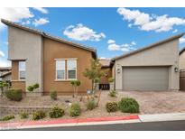 Contemporary single-story home with desert landscaping and two-car garage at 16 Via Stefano, Henderson, NV 89011