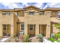Charming townhome features a covered entryway and low-maintenance landscaping at 49 Alamere Falls Dr, Las Vegas, NV 89138
