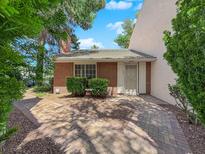 Charming brick home with a tiled roof, mature landscaping, and a welcoming front entrance at 540 Tam O Shanter, Las Vegas, NV 89109