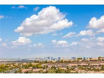 Breathtaking Las Vegas city view showcasing the skyline, rooftops, and cloudscape in a beautiful neighborhood at 1964 Oliver Springs St, Henderson, NV 89052