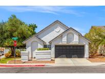 Charming single-story home with a two-car garage, and manicured landscaping in a suburban neighborhood at 2513 Aberdeen Ln, Henderson, NV 89014
