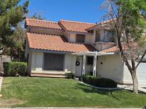 Charming home with a well-maintained lawn and inviting front porch at 3138 White Rose Way, Henderson, NV 89014