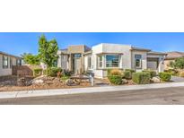 Beautiful single-story home featuring a well-manicured front yard and neutral color palette at 4893 E Cedar Creek Way, Pahrump, NV 89061
