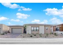 Charming single-story home featuring a neutral color scheme, low maintenance landscaping, and a two-car garage at 11049 Concord Valley Drive, Las Vegas, NV 89135