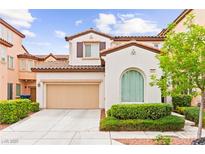 Charming two-story home with a two car garage, manicured landscaping, and a traditional architectural design at 1887 Hollywell St, Las Vegas, NV 89135
